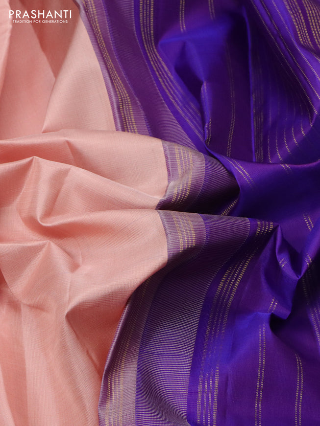 Pure kanchipuram silk saree pastel peach and violet with plain body and rich zari woven korvai border