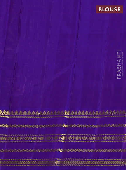Pure kanchipuram silk saree pastel peach and violet with plain body and rich zari woven korvai border