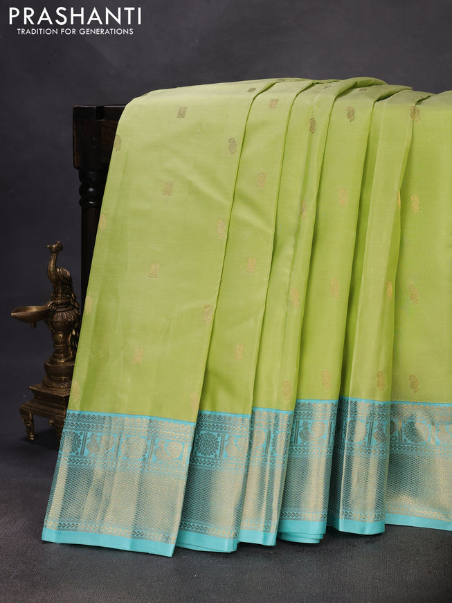 Pure kanchipuram silk saree pista green and teal blue with zari woven buttas and rich zari woven korvai border
