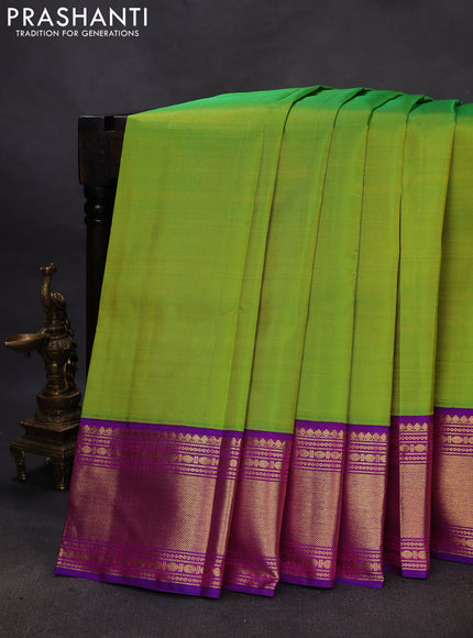 Pure kanchipuram silk saree light green and purple with plain body and rich zari woven border