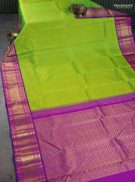 Pure kanchipuram silk saree light green and purple with plain body and rich zari woven border