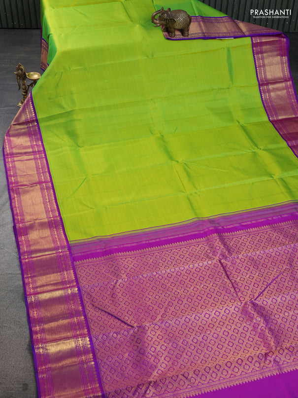 Pure kanchipuram silk saree light green and purple with plain body and rich zari woven border