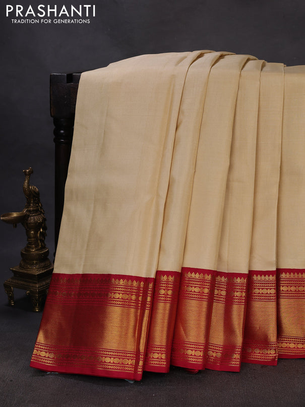 Pure kanchipuram silk saree cream and maroon with plain body and rich zari woven border