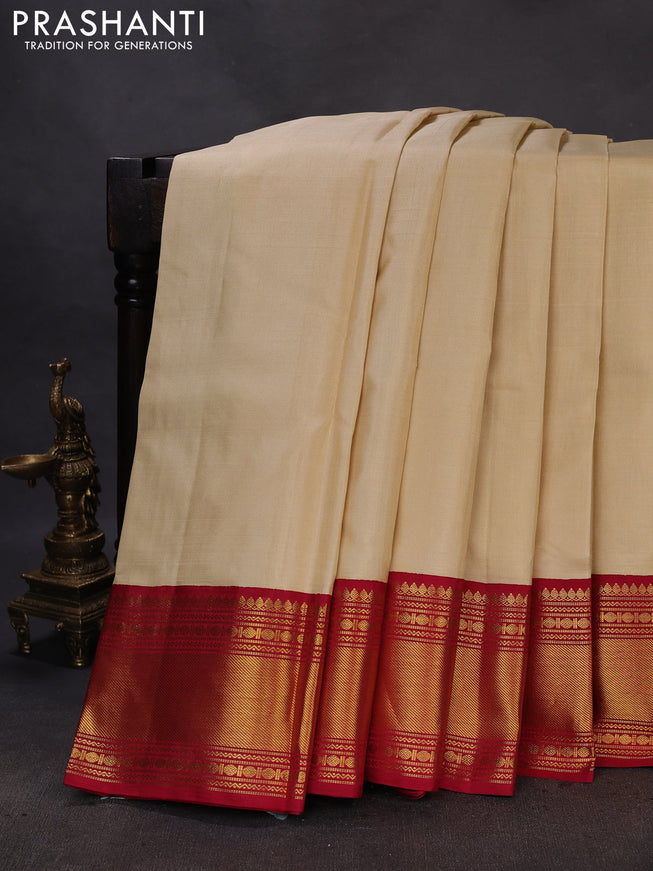 Pure kanchipuram silk saree cream and maroon with plain body and rich zari woven border