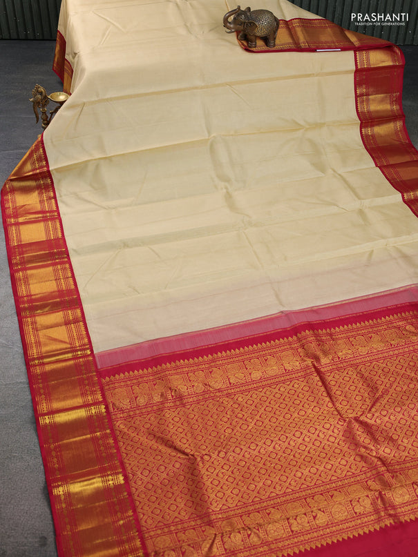 Pure kanchipuram silk saree cream and maroon with plain body and rich zari woven border