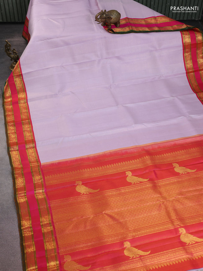 Pure kanchipuram silk saree mild lavender and pink with allover zari stripe pattern and rettapet zari woven korvai border