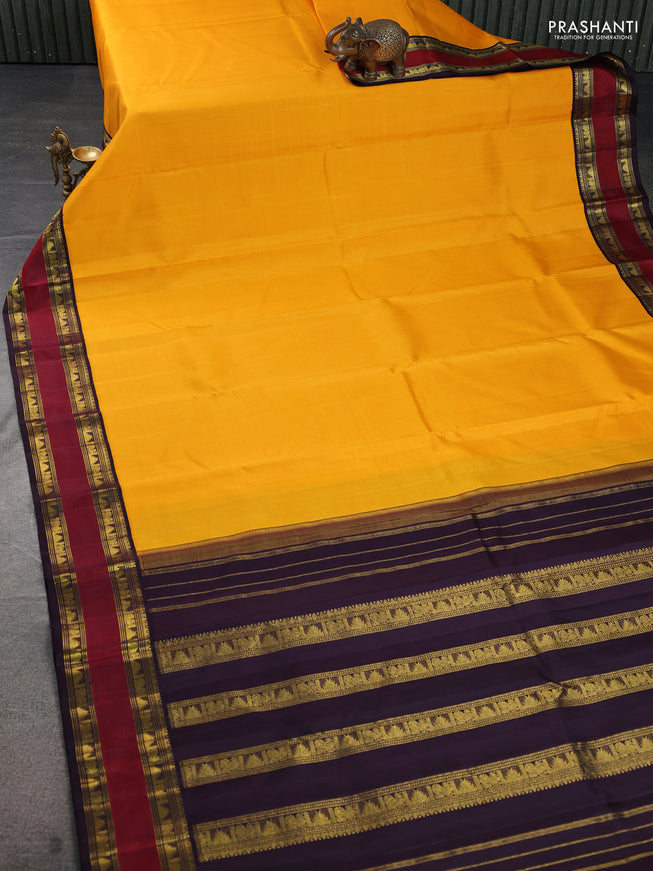 Pure kanchipuram silk saree mango yellow and deep wine with plain body and rettapet zari woven korvai border