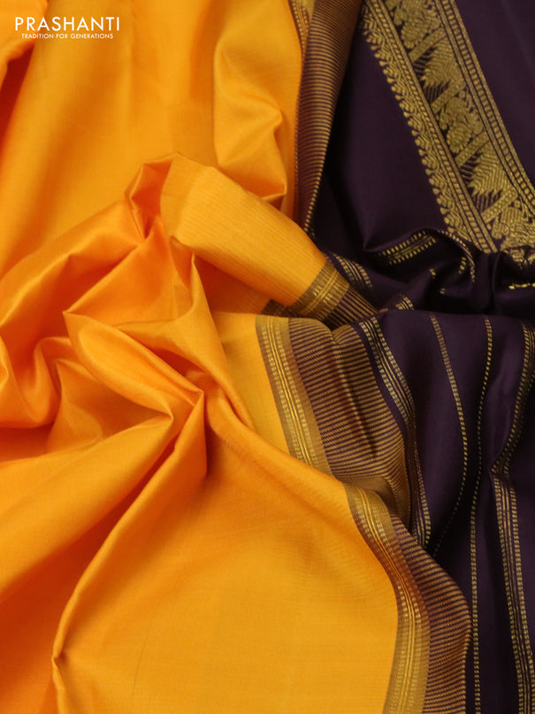 Pure kanchipuram silk saree mango yellow and deep wine with plain body and rettapet zari woven korvai border