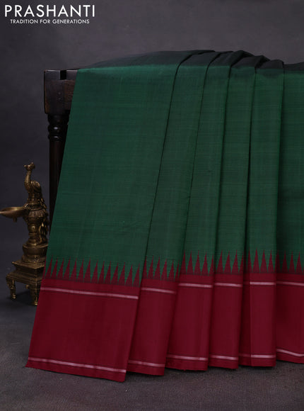 Pure kanchipuram silk saree dark green and maroon with plain body and temple design rettapet border