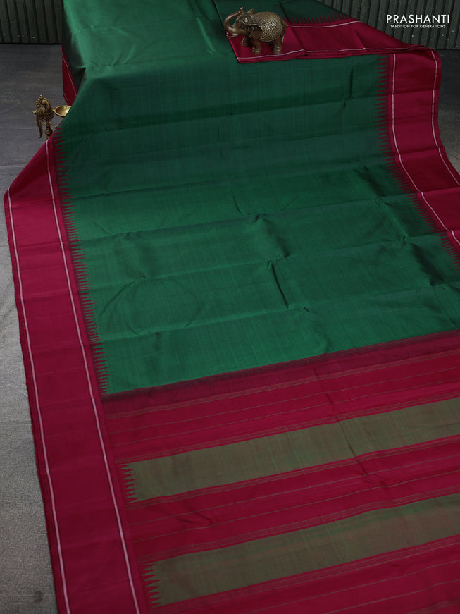 Pure kanchipuram silk saree dark green and maroon with plain body and temple design rettapet border