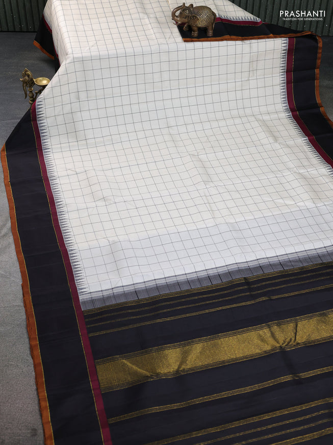 Pure kanchipuram silk saree cream and black with allover checked pattern and temple design rettapet border
