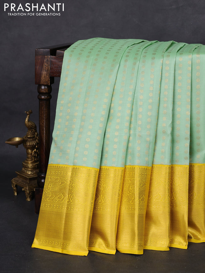 Pure kanchipuram silk saree pastel green and yellow with allover zari woven 1000 buttas and long zari woven border