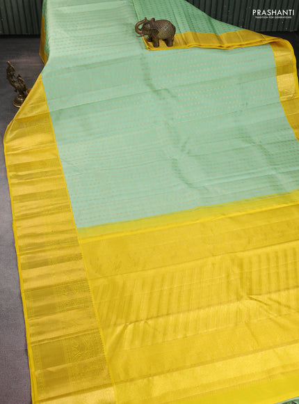 Pure kanchipuram silk saree pastel green and yellow with allover zari woven 1000 buttas and long zari woven border