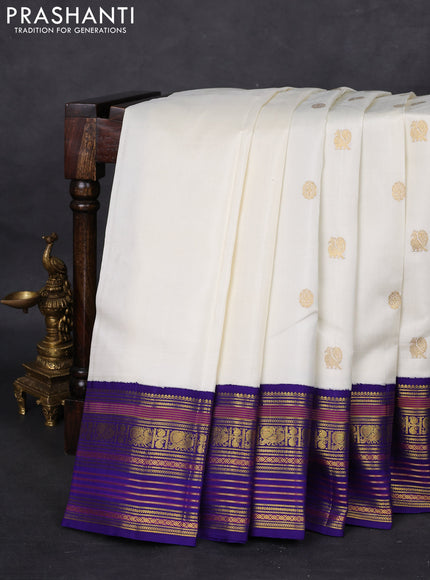 Pure kanchipuram silk saree off white and blue with zari woven buttas and zari woven korvai border
