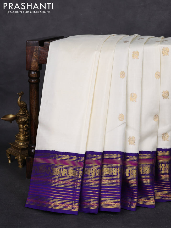 Pure kanchipuram silk saree off white and blue with zari woven buttas and zari woven korvai border