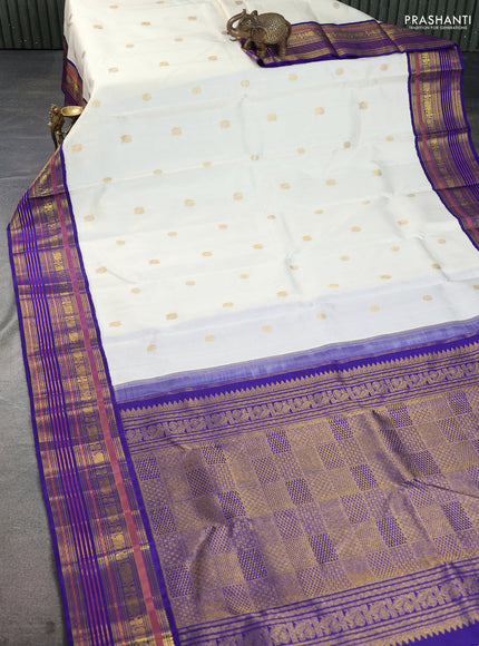 Pure kanchipuram silk saree off white and blue with zari woven buttas and zari woven korvai border