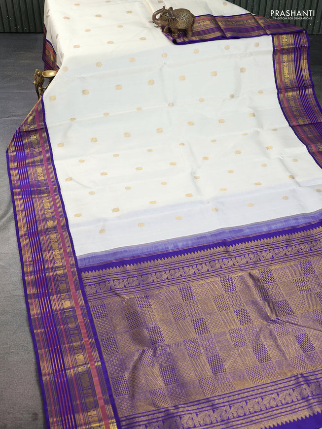 Pure kanchipuram silk saree off white and blue with zari woven buttas and zari woven korvai border