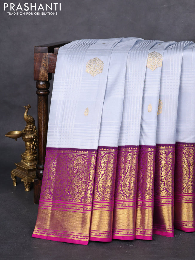 Pure kanchipuram silk saree pastel grey and purple with allover self emboss & zari buttas and long paisley zari woven korvai border