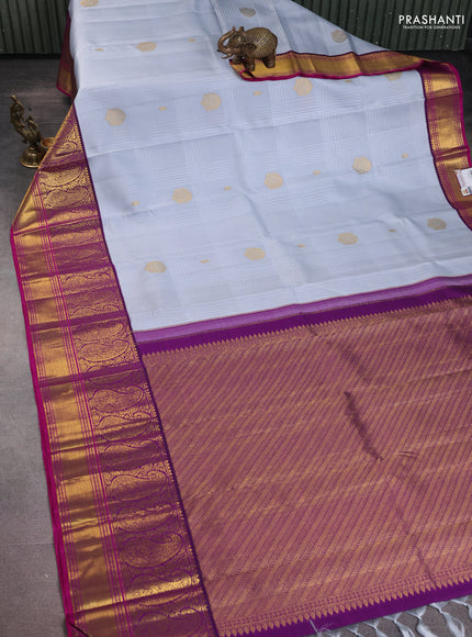 Pure kanchipuram silk saree pastel grey and purple with allover self emboss & zari buttas and long paisley zari woven korvai border