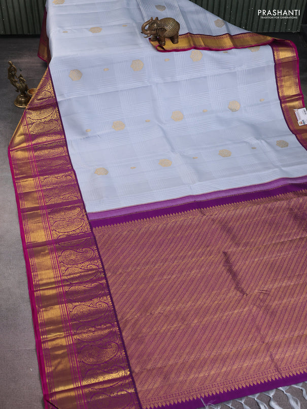 Pure kanchipuram silk saree pastel grey and purple with allover self emboss & zari buttas and long paisley zari woven korvai border