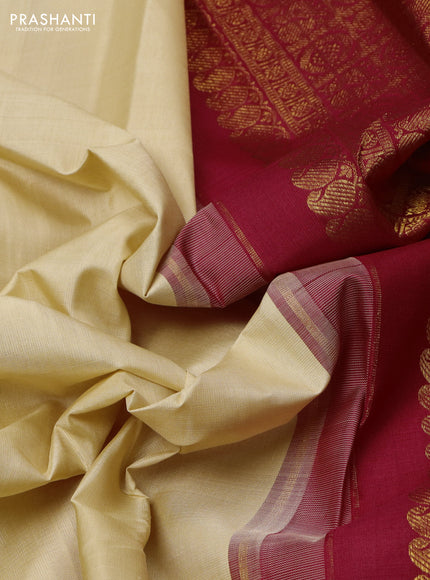 Pure kanchipuram silk saree cream and maroon with plain body and long zari woven korvai border