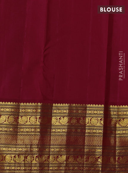Pure kanchipuram silk saree cream and maroon with plain body and long zari woven korvai border