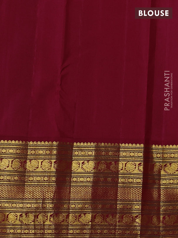 Pure kanchipuram silk saree cream and maroon with plain body and long zari woven korvai border