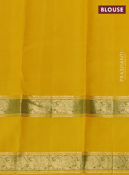 Pure kanchipuram silk saree off white and yellow with allover zari woven rocade weaves and long rettapet zari woven border