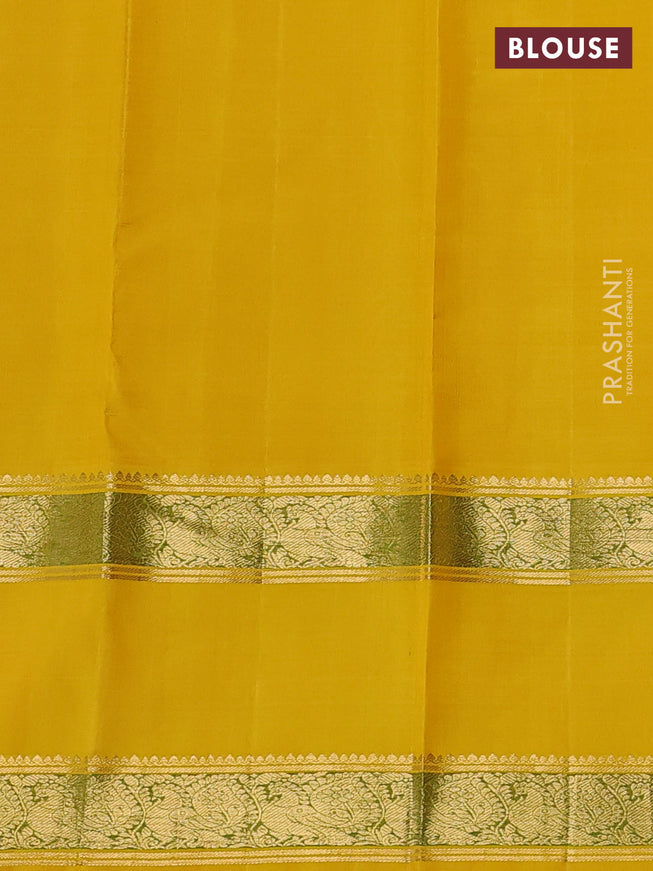 Pure kanchipuram silk saree off white and yellow with allover zari woven rocade weaves and long rettapet zari woven border