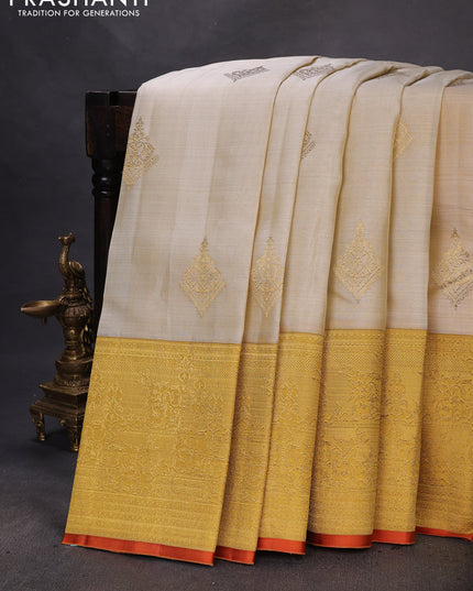 Pure kanchipuram silk saree cream and mustard yellow with zari woven buttas and long zari woven border