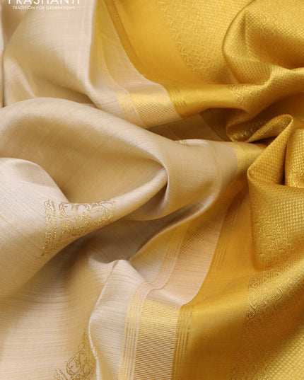 Pure kanchipuram silk saree cream and mustard yellow with zari woven buttas and long zari woven border