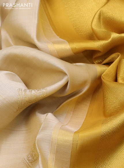 Pure kanchipuram silk saree cream and mustard yellow with zari woven buttas and long zari woven border