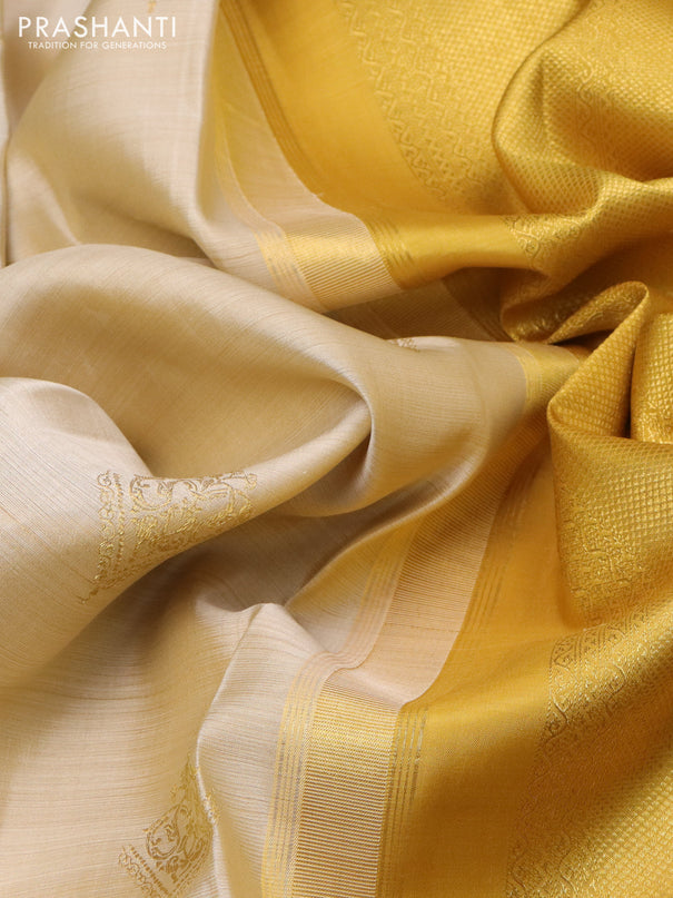 Pure kanchipuram silk saree cream and mustard yellow with zari woven buttas and long zari woven border