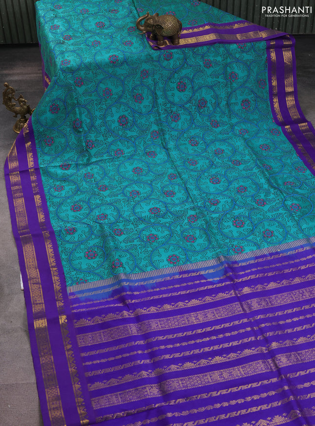 Silk cotton saree teal blue and violet with allover kalamkari prints and rettapet zari woven korvai border