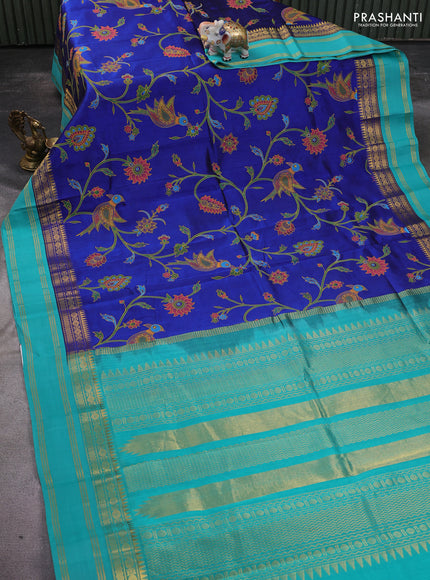 Silk cotton saree blue and teal green with allover kalamkari prints and rettapet zari woven border