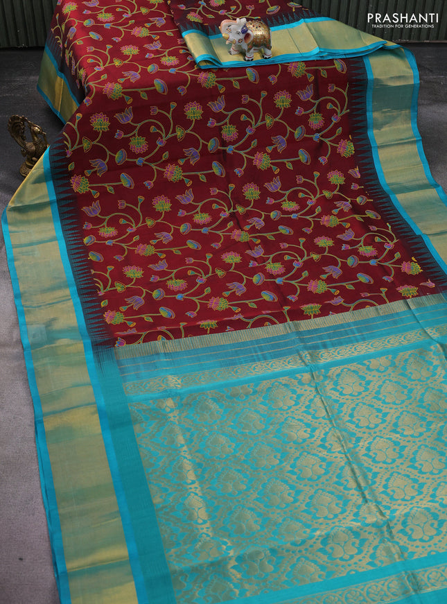 Silk cotton saree maroon and teal blue with allover pichwai prints and temple design zari woven border