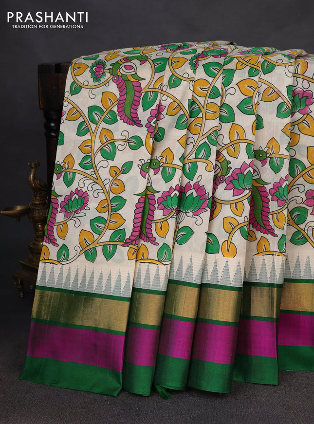 Silk cotton saree cream and green with allover kalamkari prints and temple design zari woven simple border
