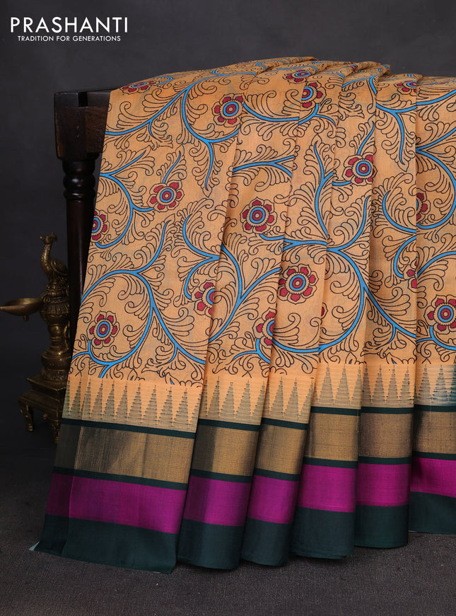 Silk cotton saree pale orange and dark green with allover kalamkari prints and temple design zari woven simple border