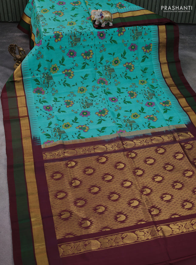 Silk cotton saree teal blue and deep maroon with allover kalamkari prints and temple design zari woven simple border
