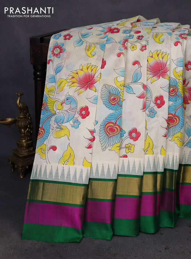 Silk cotton saree cream and green with allover kalamkari prints and temple design zari woven simple border