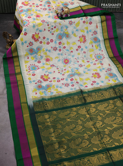 Silk cotton saree cream and green with allover kalamkari prints and temple design zari woven simple border