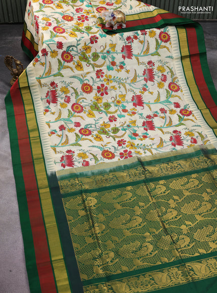 Silk cotton saree cream and green with allover kalamkari prints and temple design zari woven simple border