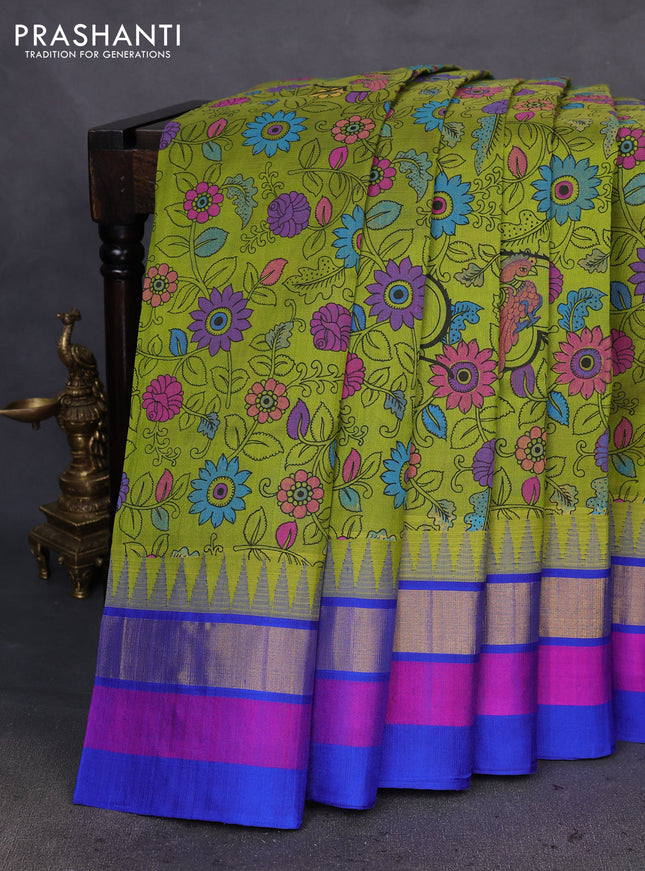 Silk cotton saree light green and blue with allover kalamkari prints and temple design zari woven simple border