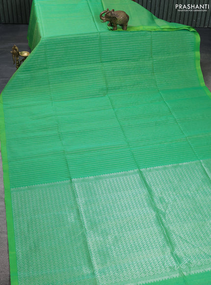 Kora silk cotton saree green with allover silver zari woven checked pattern and simple border