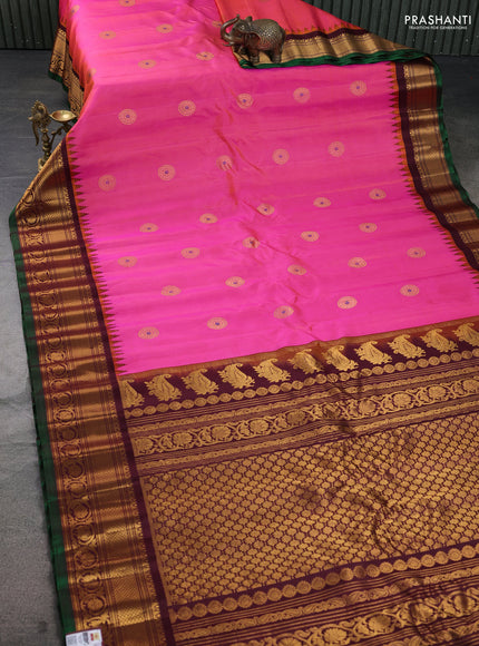 Pure gadwal silk saree dual shade of pinkish orange and deep maroon with zari woven buttas and temple design zari woven border