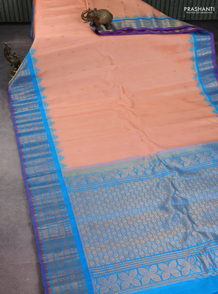 Pure gadwal silk saree peach orange and cs blue with zari woven buttas and temple design zari woven border