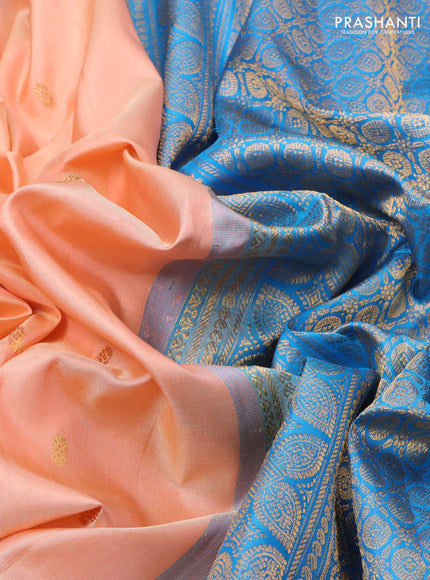 Pure gadwal silk saree peach orange and cs blue with zari woven buttas and temple design zari woven border