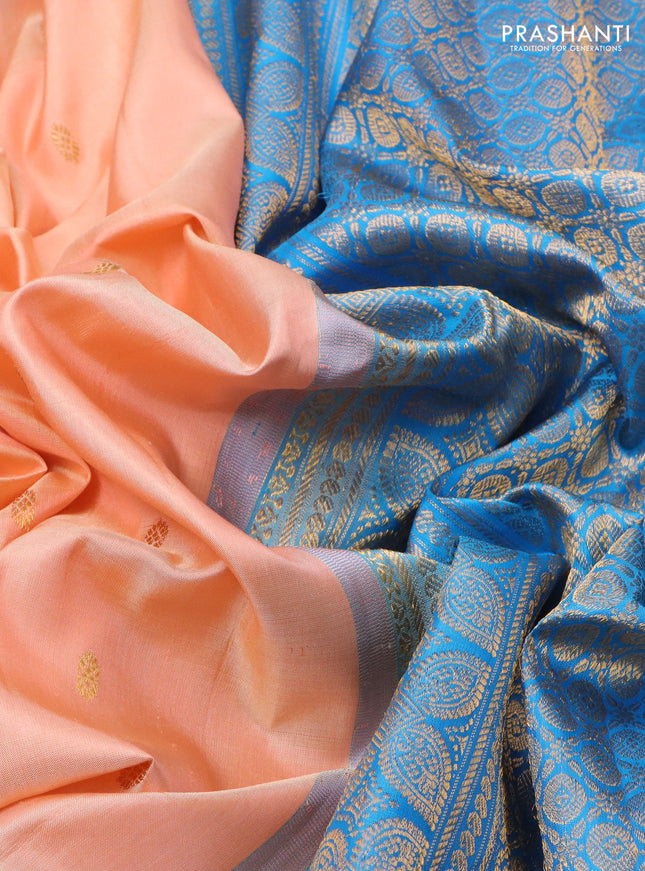 Pure gadwal silk saree peach orange and cs blue with zari woven buttas and temple design zari woven border