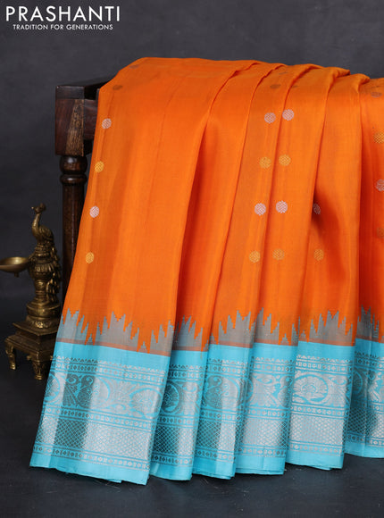 Pure gadwal silk saree orange and light blue with silver & gold zari woven buttas and temple design silver zari woven border
