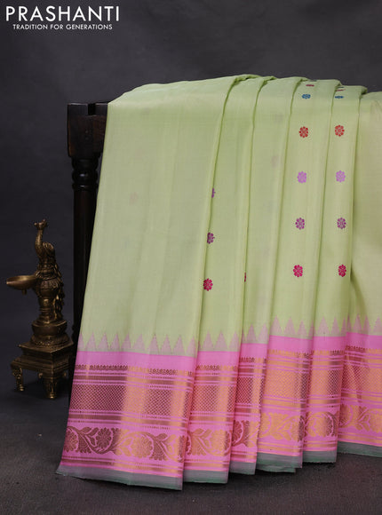 Pure gadwal silk saree pista green and light pink with thread woven buttas and temple design zari woven border